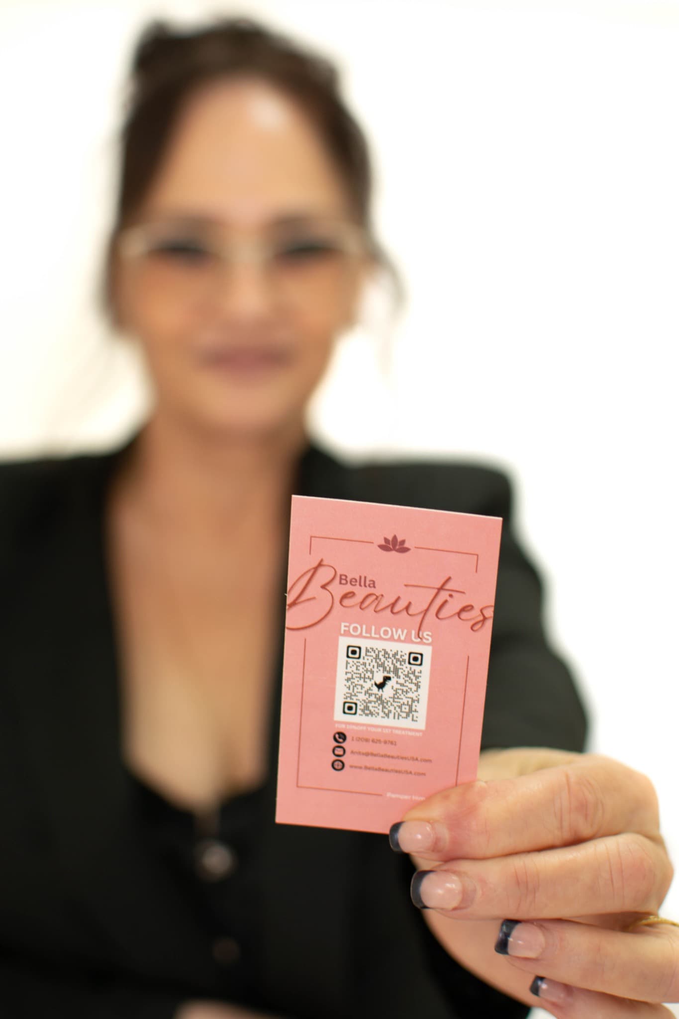 Anita holding a Bella Beauties business card